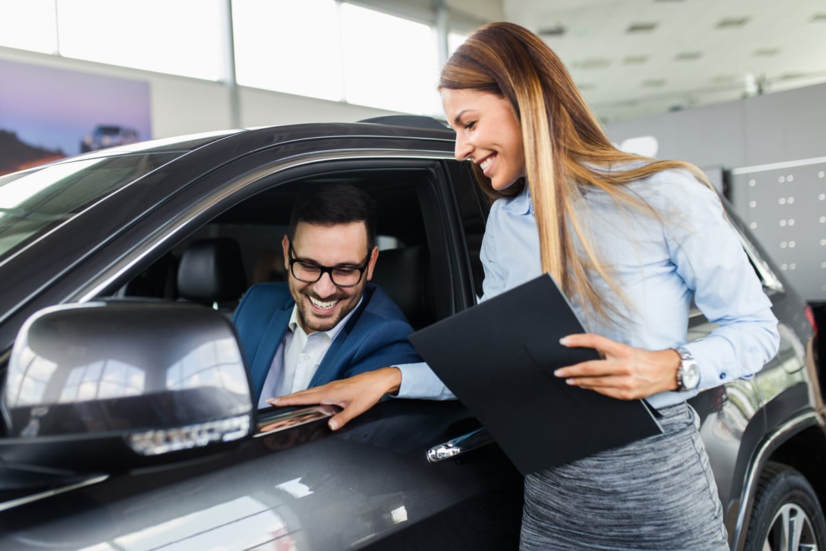 Saleswoman talking with a potential buyer